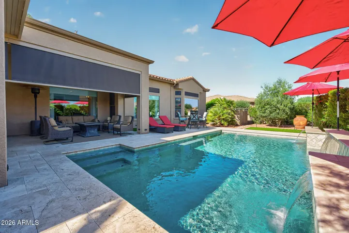 Notice all of the patio space around the pool and back of the home.