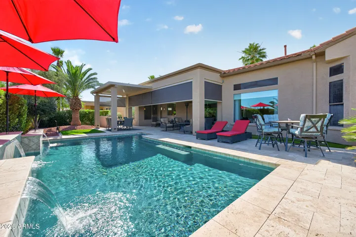 Relax and unwind in the pool or on the extended travertine patio.