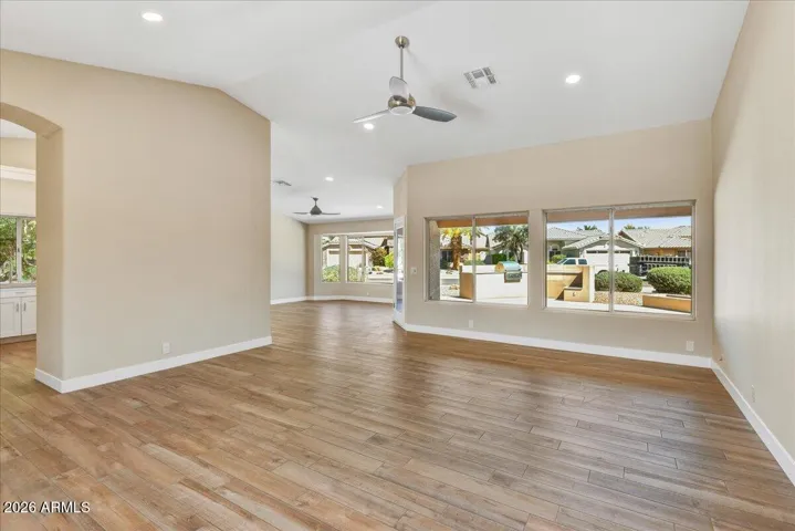 Step into this freshly renovated home featuring neutral plank tile flooring , fresh paint, vaulted ceilings, recessed lighting and so much more!