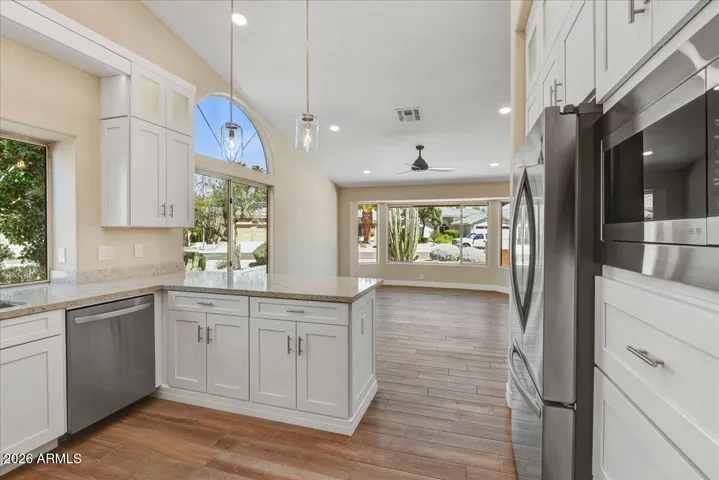 Another view of the kitchen opening to the family room