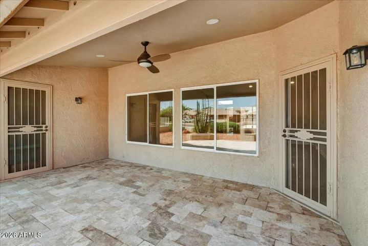 Covered patio with gorgeous travertine tile