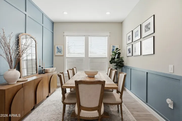 BRIGHT AND INVITING DINING ROOM ENHANCED BY CUSTOM PANELS