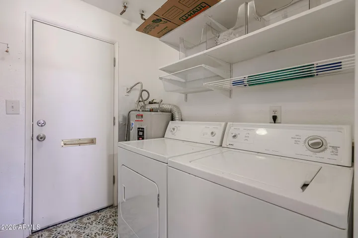 **"This modular command center utilizes an adaptive pegboard system with customizable hooks and handles, keeping all your essential handyman tools streamlined and within arm's reach."**