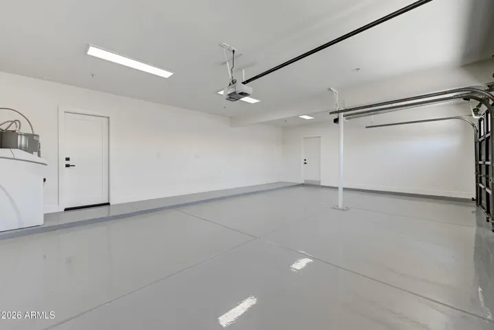 Deep 3-Car Garage with Custom Lighting and Epoxy Floor with Side Door to R.V. Gate