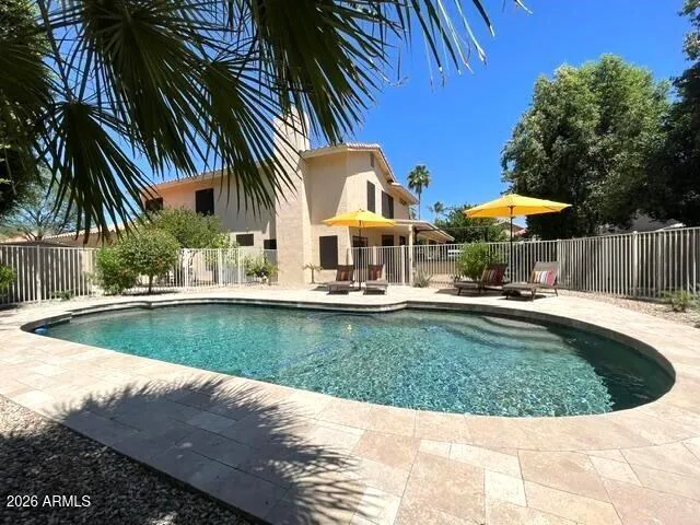 Pebble Tech Style Pool with Travertine Decking