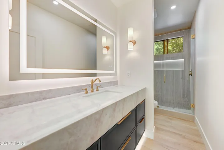 Down Stairs Bathroom next to Bedroom 1 with Smart Mirror