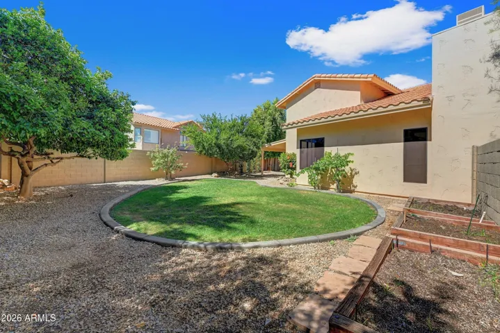 Backyard Grass Area with Raised Vegetable Gardens