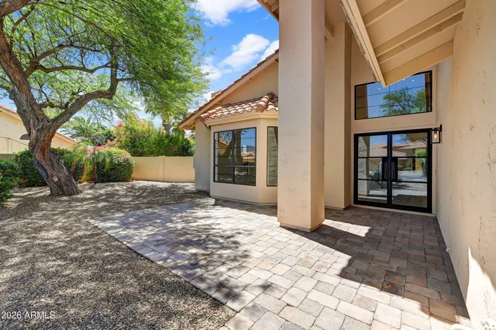 Front Paver Patio with Custom Glass Door at Entry