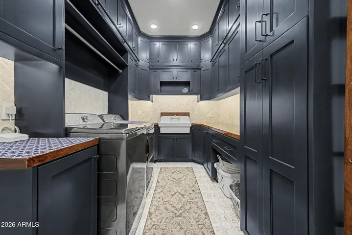 Beautiful laundry room with an unbelievable amount of storage