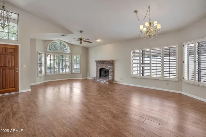 Great Room With Fireplace and Bay Window - Wood Shutters
