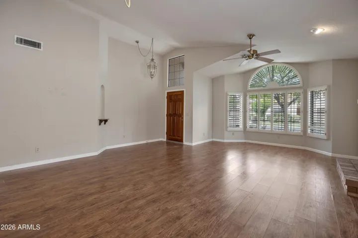 Great Room With Fireplace and Bay Window - Wood Shutters