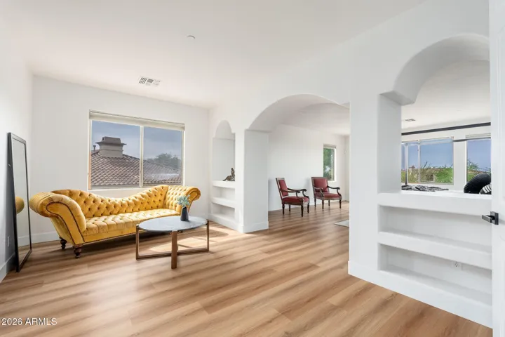 Primary bedroom with sitting room and door to balcony