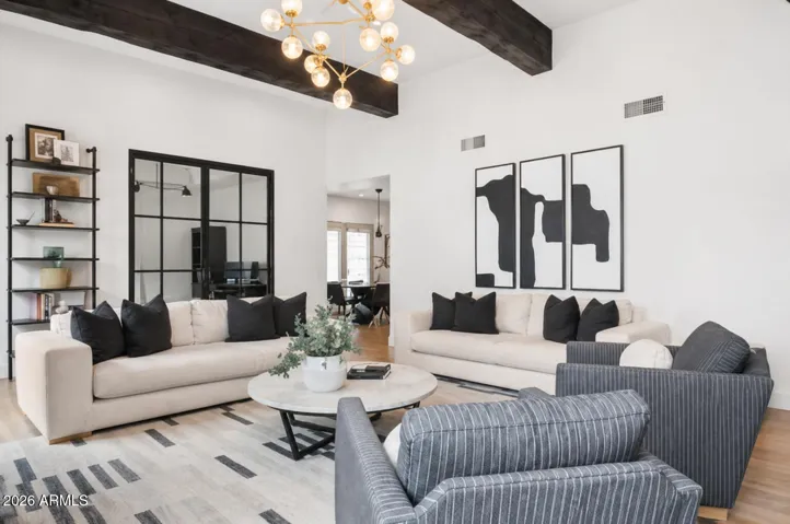 The room has been virtually staged with glass doors to show buyers the potential