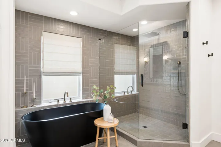 Spa vibes, but make it daily life—this bathroom brings the wow with a sleek freestanding tub and a glass walk-in shower wrapped in timeless tile. Clean, calming, and just the right amount of luxury.