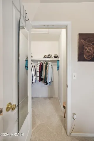 Primary Bedroom walk in closet - there is shelving on the right side of the closet also