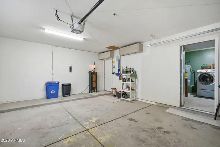 Entrance to Laundry room from garage. With this separate room you don't have the noise of the machines and keep the heat separate from the main house.