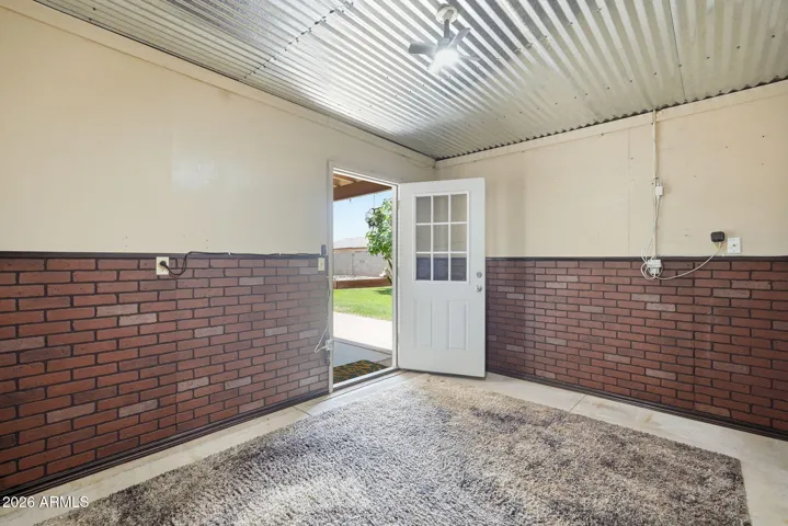 Enjoy this dedicated room for either hobbies or as a workshop. Portable AC unit keep the area cool in summer.