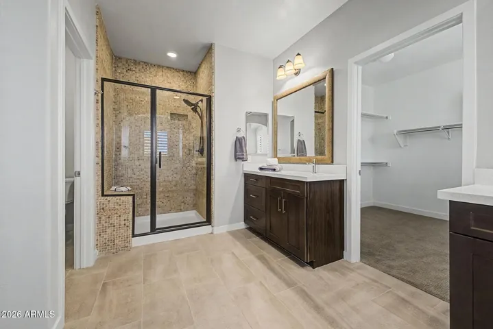 Separate shower is large with new glass surround, bench and shower head.