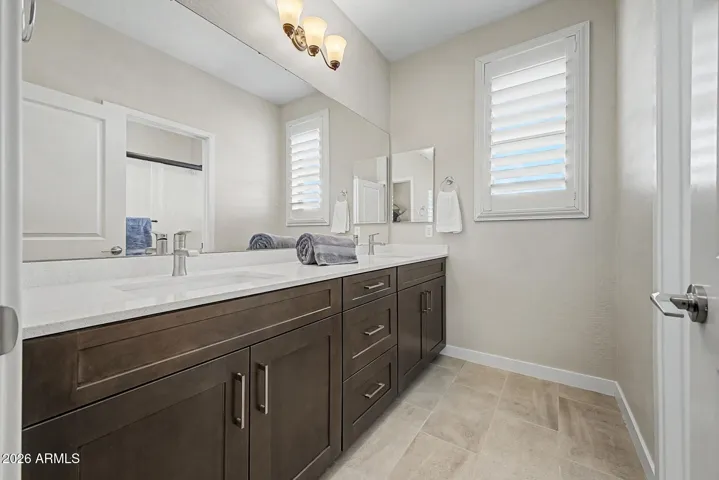 Upstairs guest bath has 2 sinks for large families or several guests at a time.
