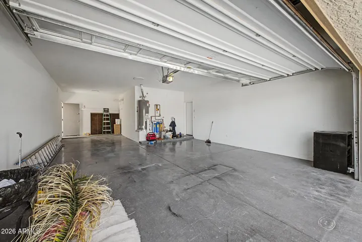 3 car tandem garage has direct access to the back yard.