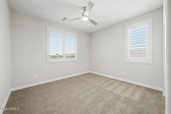 Large guest bedrooms built for comfort with 9' ceilings and large windows