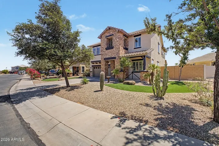Freshly painted exterior, elegant rock accent and meticulous landscape presents gorgeous curb appeal.