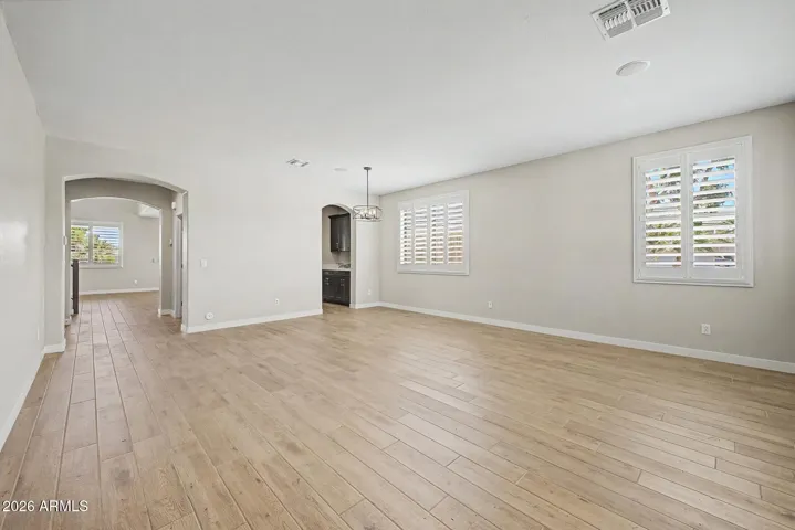 Left side passes the garage, under stairs closet and guest powder room.