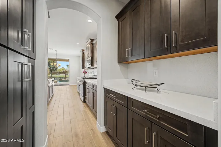 Butler pantry with counter space and plenty of storage