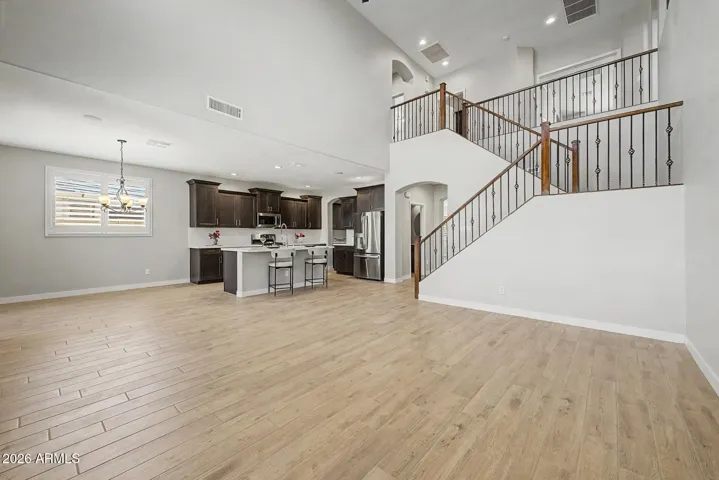 Catch your breath as you walk into this great room with soaring 20+ foot ceilings, perfectly placed dinette, grand staircase and fully updated kitchen.