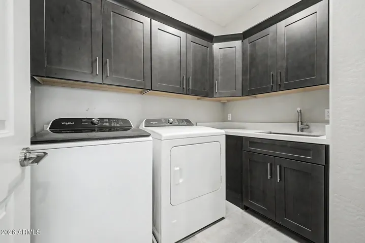 Upstairs laundry room means no hauling clothes up and down the stairs. Solar tube provides great daytime lighting and you don't have to walk through here to get to the garage!!