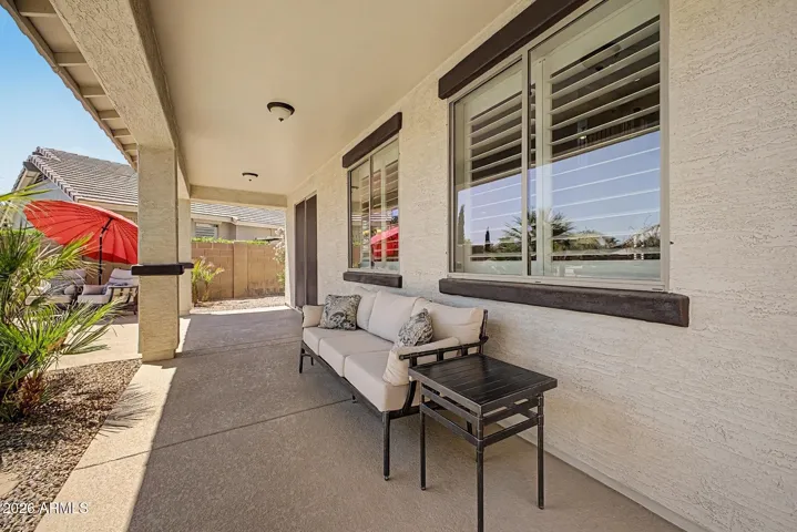 Freshly resurfaced cool deck completes the meticulous look of this back yard oasis.