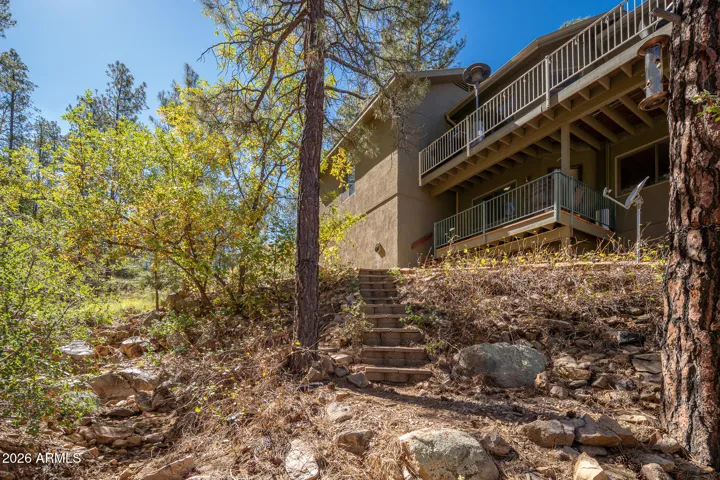Rear view looking up at property from seasonal creek