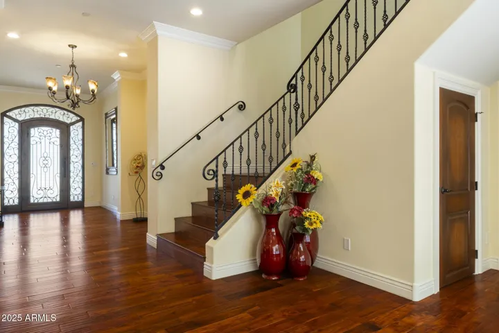 Staircase to upper level primary ensuite bedroom