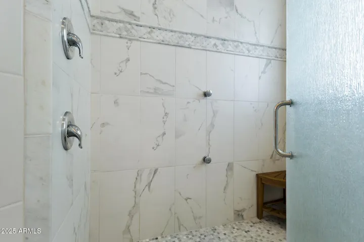 Upper level primary ensuite bathroom shower