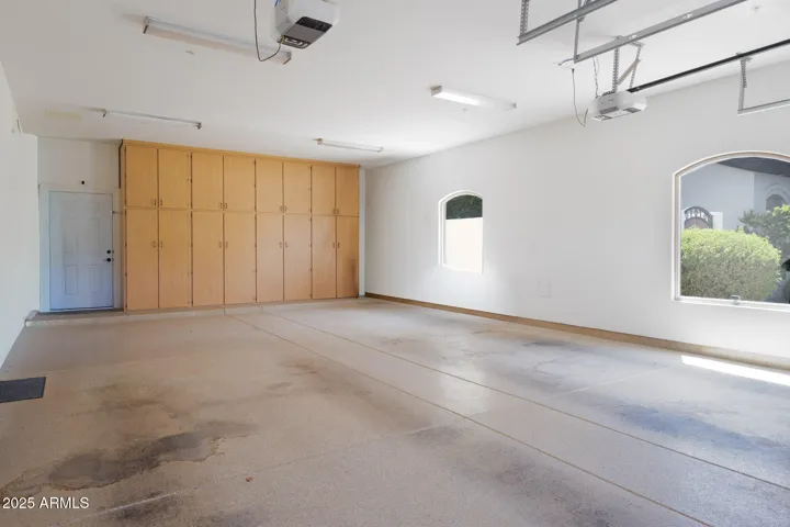 4 car tandem garage with storage cabinets