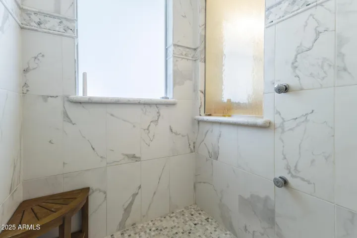 Upper level primary ensuite bathroom shower
