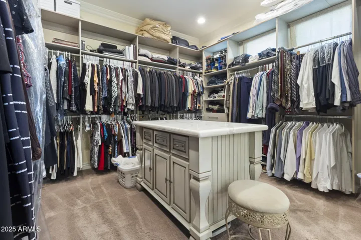 Upper level primary ensuite walk-in closet