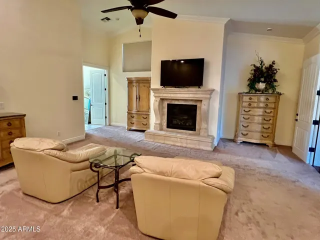 Upper level primary ensuite bedroom with gas fireplace