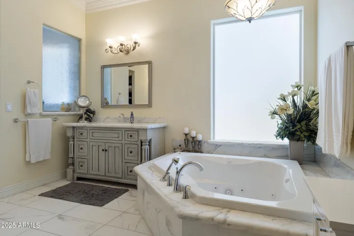 Upper level primary ensuite bathroom with jetted tub