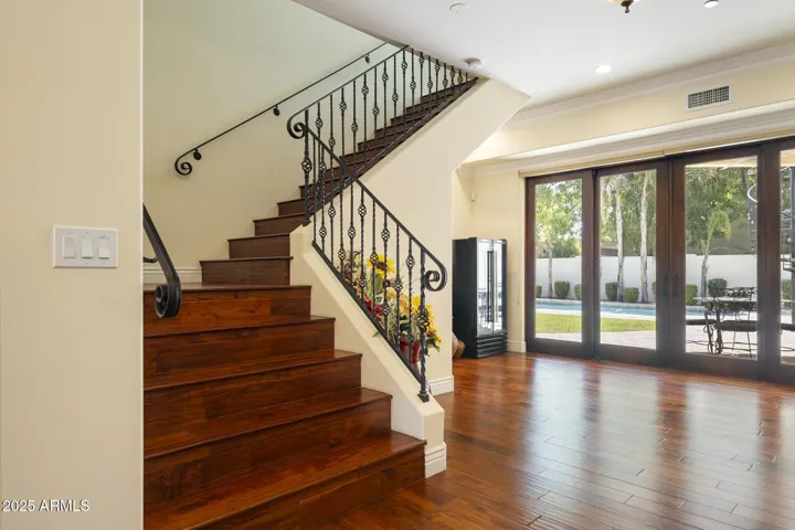 Staircase to upper primary bedroom