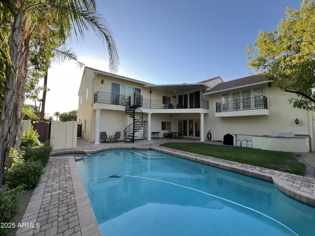 Rear exterior, paver patio and pool deck