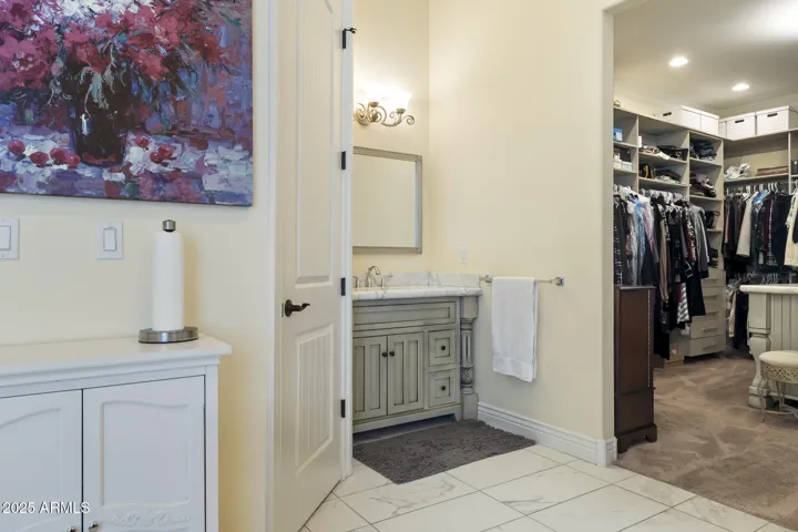 Upper level primary ensuite bathroom with 2 sinks and vanities