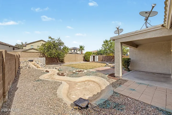 Spacious Backyard with Water Feature