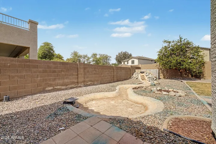Spacious Backyard with Water Feature