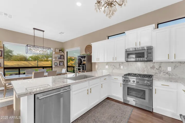 Remodeled kitchen with new quartz countertops, refinished extended cabinets and custom glass 'Pantry' door!