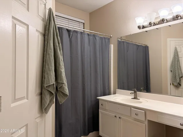 Separate toilet room with a Shower tub combo