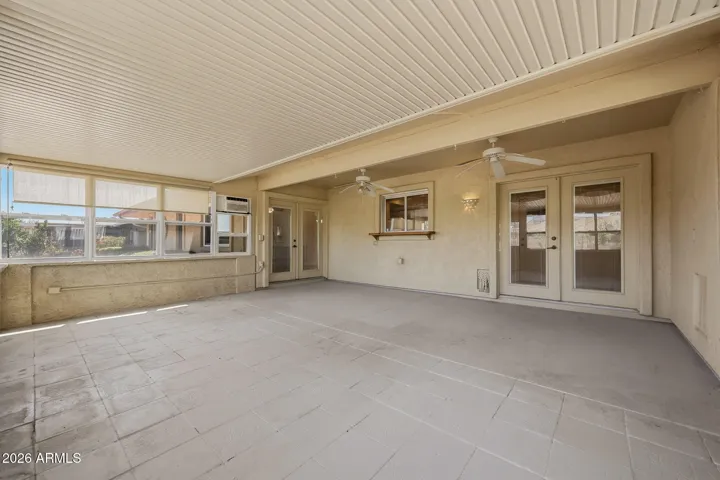 French doors lead to the Kitchen and Arizona Room.