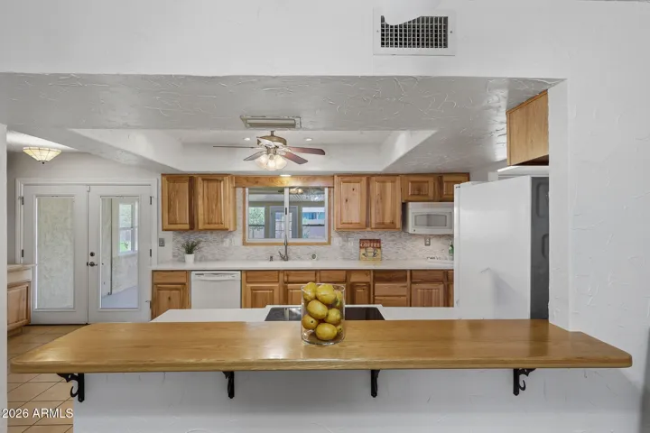 View from Living Room into Kitchen Area.