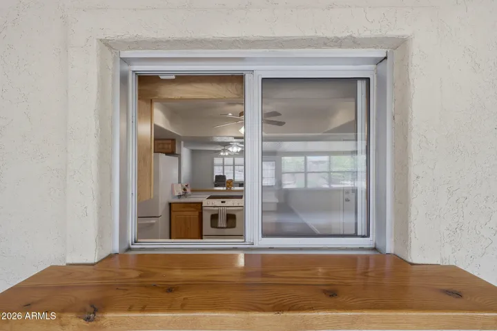 Pass-through from the Kitchen to the Enclosed Patio room.