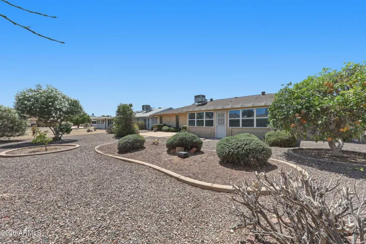 In the backyard you will find fruit trees and an uncovered Patio area for BBQing or enjoying the beautiful Arizona weather.